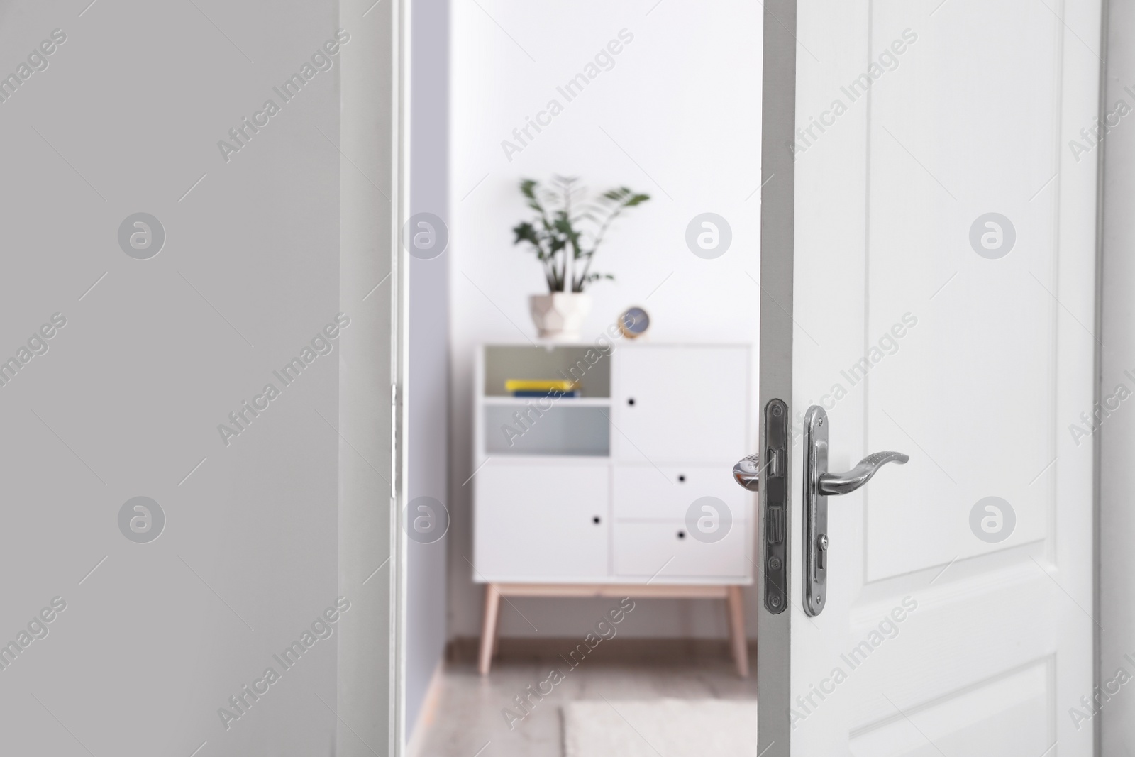 Photo of Room interior with new furniture, view through open door