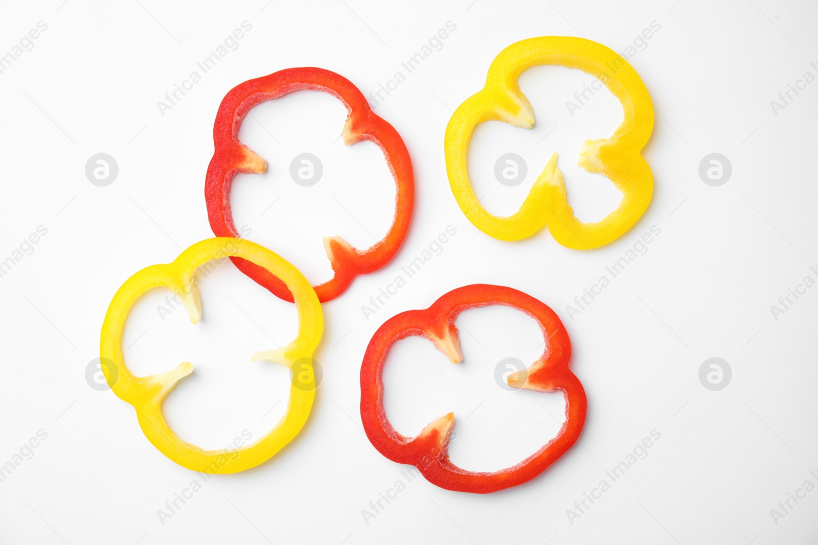 Photo of Cut ripe paprika pepper on white background, top view