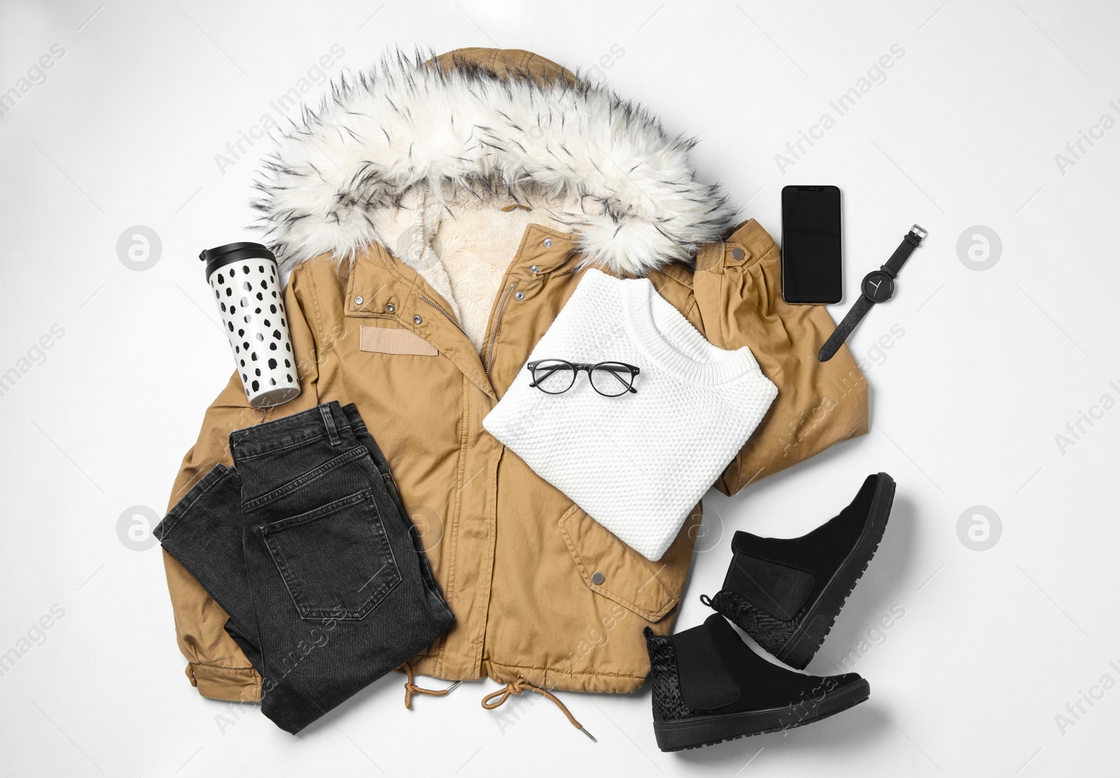 Photo of Set of stylish winter clothes on white background, top view