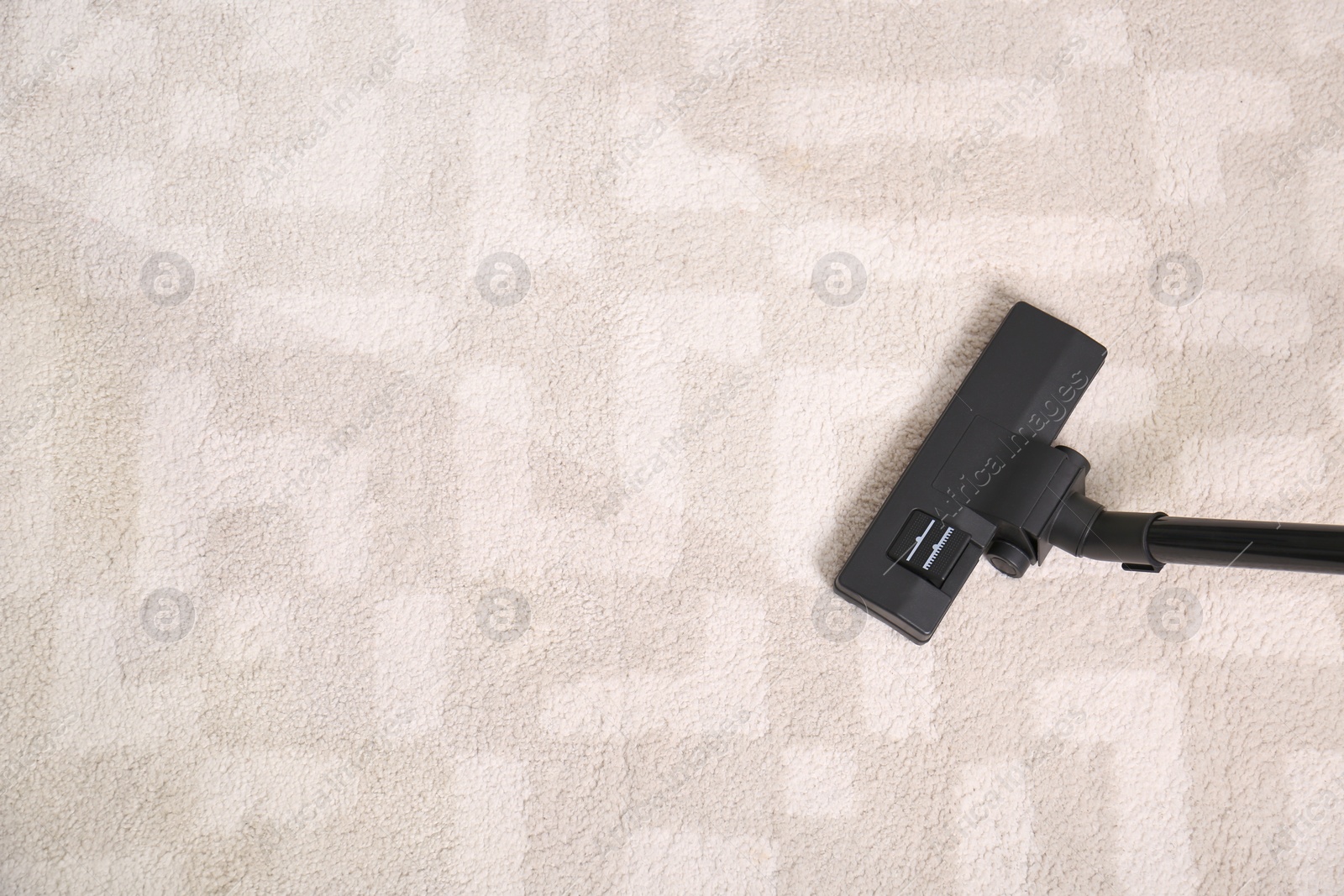 Image of Vacuuming dirty carpet. Clean area after using device, top view