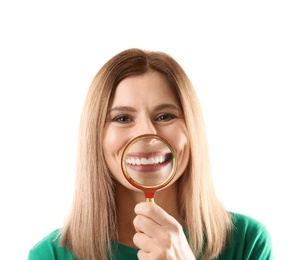 Photo of Smiling woman with perfect teeth and magnifier on white background