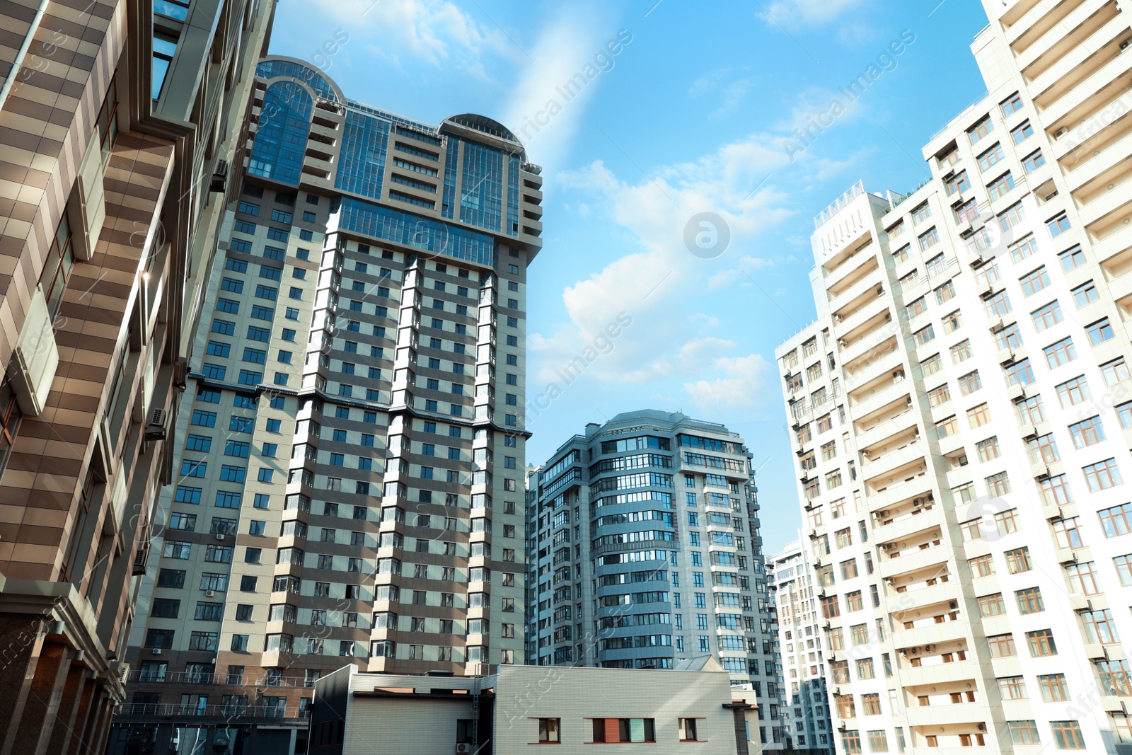 Photo of Beautiful modern buildings on sunny day, low angle view