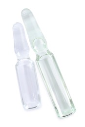 Photo of Glass ampoules with pharmaceutical product on white background, top view