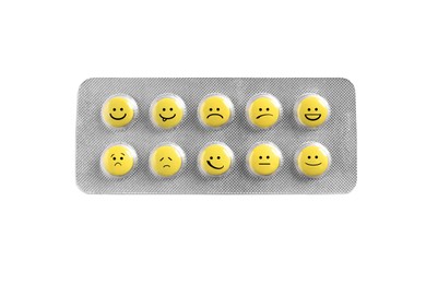 Image of Yellow pills with different emotional faces in blister on white background