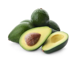 Photo of Ripe avocados on white background. Tropical fruit