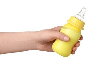 Woman holding feeding bottle with milk on white background, closeup