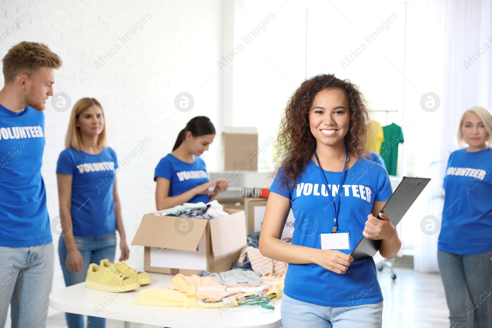 Photo of Portrait of happy African-American volunteer in uniform indoors