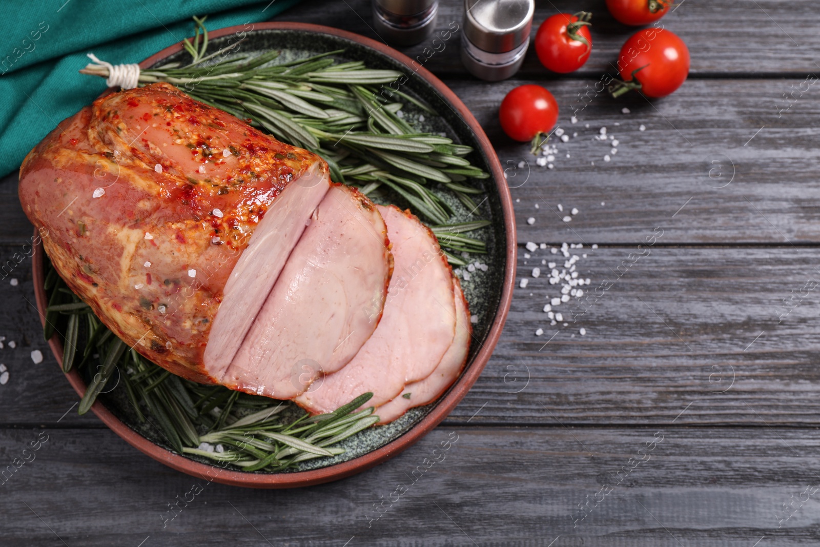 Photo of Delicious cooked ham served on wooden table, flat lay. Space for text