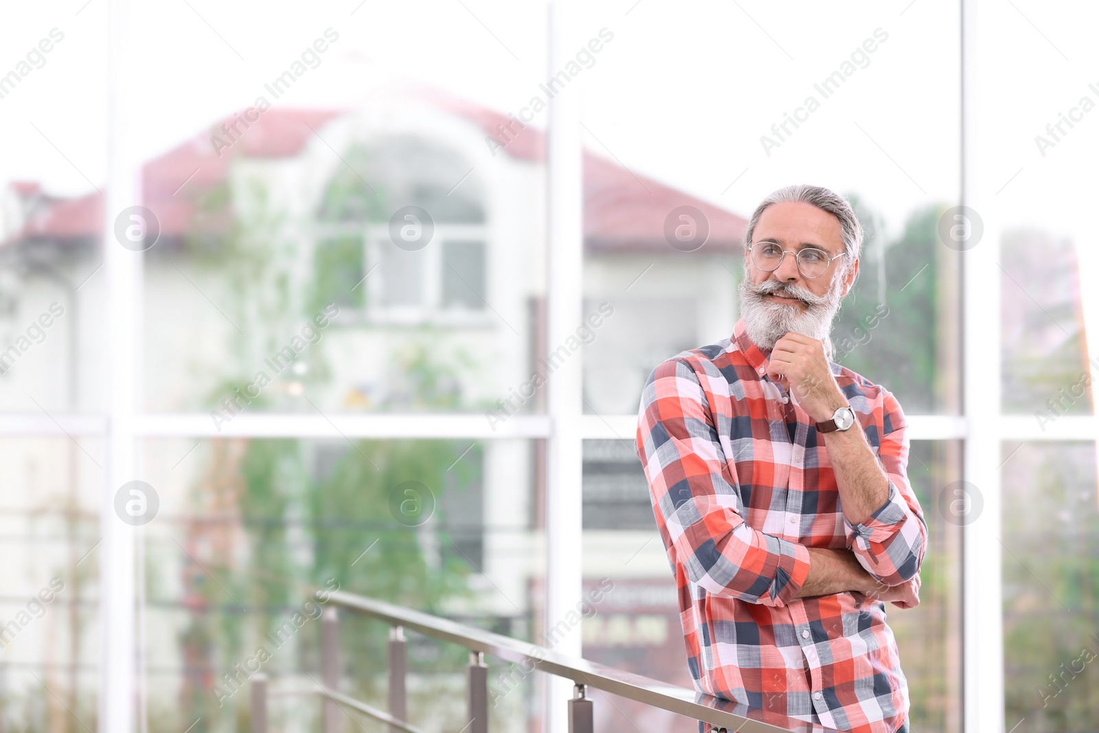 Photo of Portrait of handsome bearded mature man, indoors