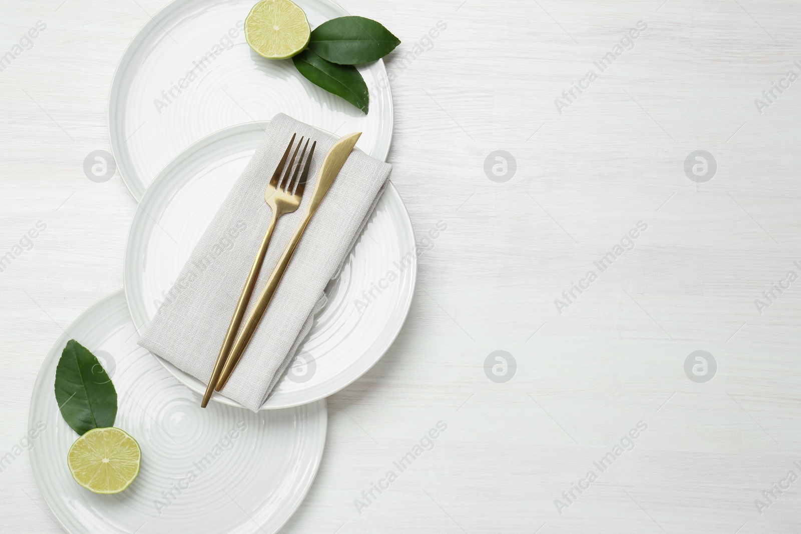 Photo of Composition with stylish ceramic plates on white wooden table, top view. Space for text