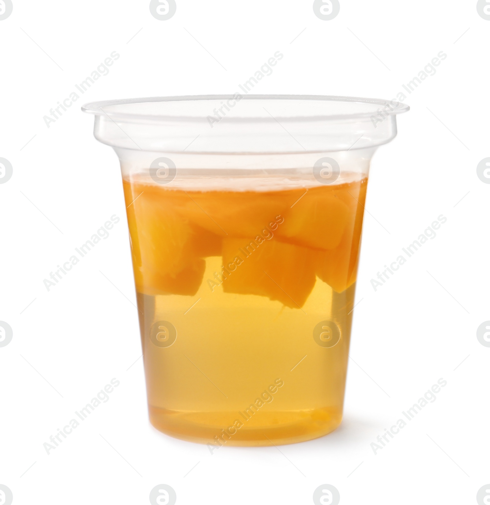 Photo of Tasty jelly dessert with slices of fruit in plastic cup on white background