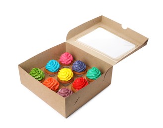 Photo of Box with delicious colorful cupcakes isolated on white