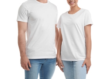 Young couple in t-shirts on white background. Mockup for design