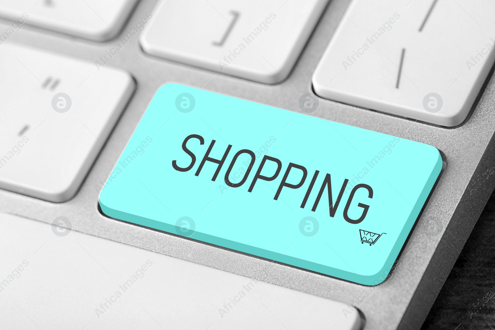 Image of Online store. Turquoise button with word SHOPPING on computer keyboard, closeup