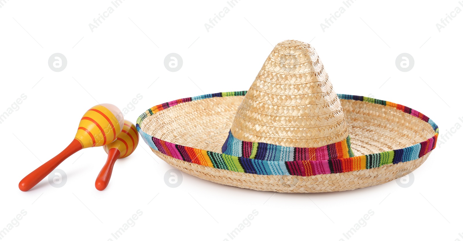 Photo of Mexican sombrero hat and maracas isolated on white