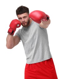 Photo of Man in boxing gloves fighting on white background