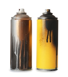 Photo of Used cans of spray paint on white background