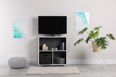 Photo of Modern TV set in living room interior
