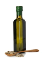 Vegetable fats. Sunflower oil in glass bottle and seeds isolated on white