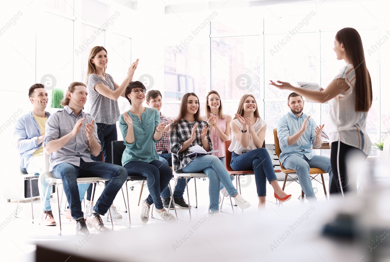 Photo of Female business trainer giving lecture in office