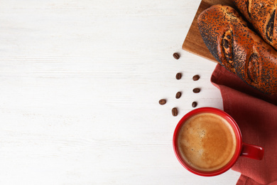 Photo of Delicious coffee and pastries on white wooden table, flat lay. Space for text