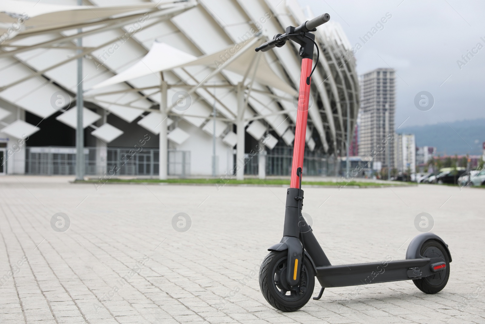 Photo of Modern electric scooter outdoors on sunny day, space for text. Rental service