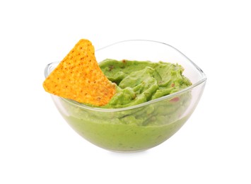 Bowl of delicious guacamole with nachos chip isolated on white
