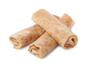 Photo of Many delicious rolled crepes on white background