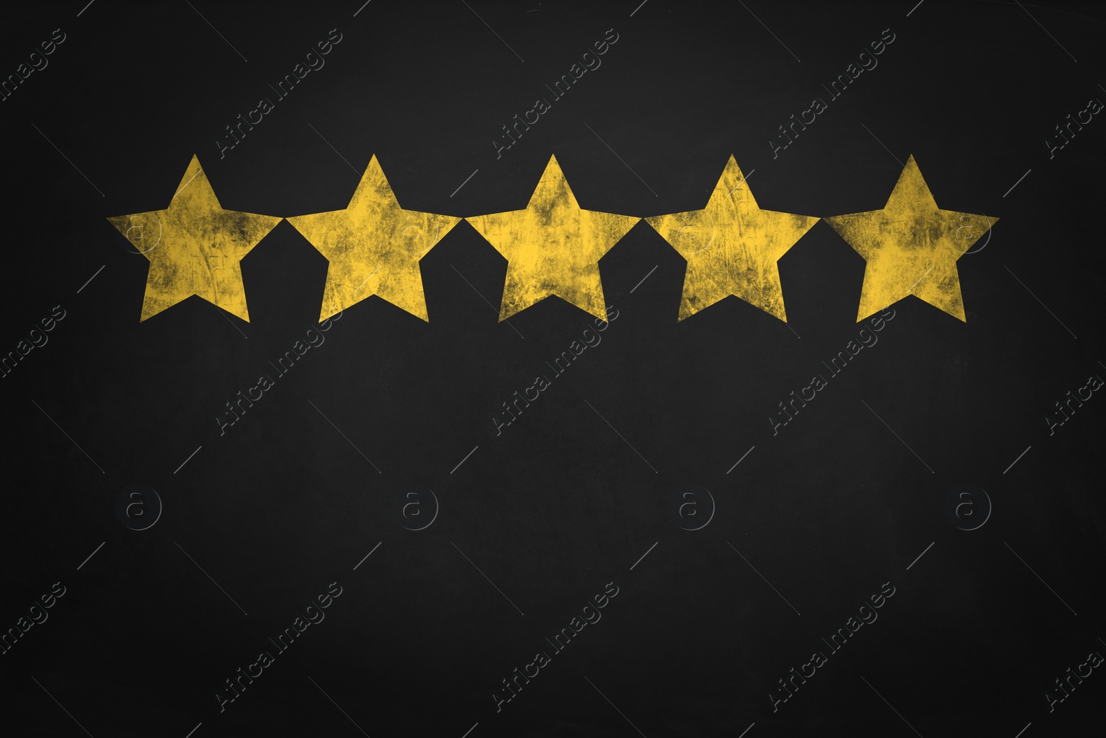 Image of Quality evaluation. Golden stars on black chalkboard