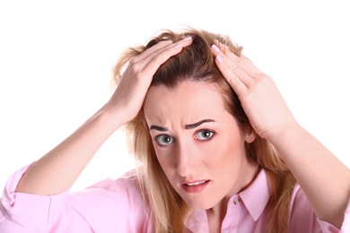 Young woman with hair loss problem on white background