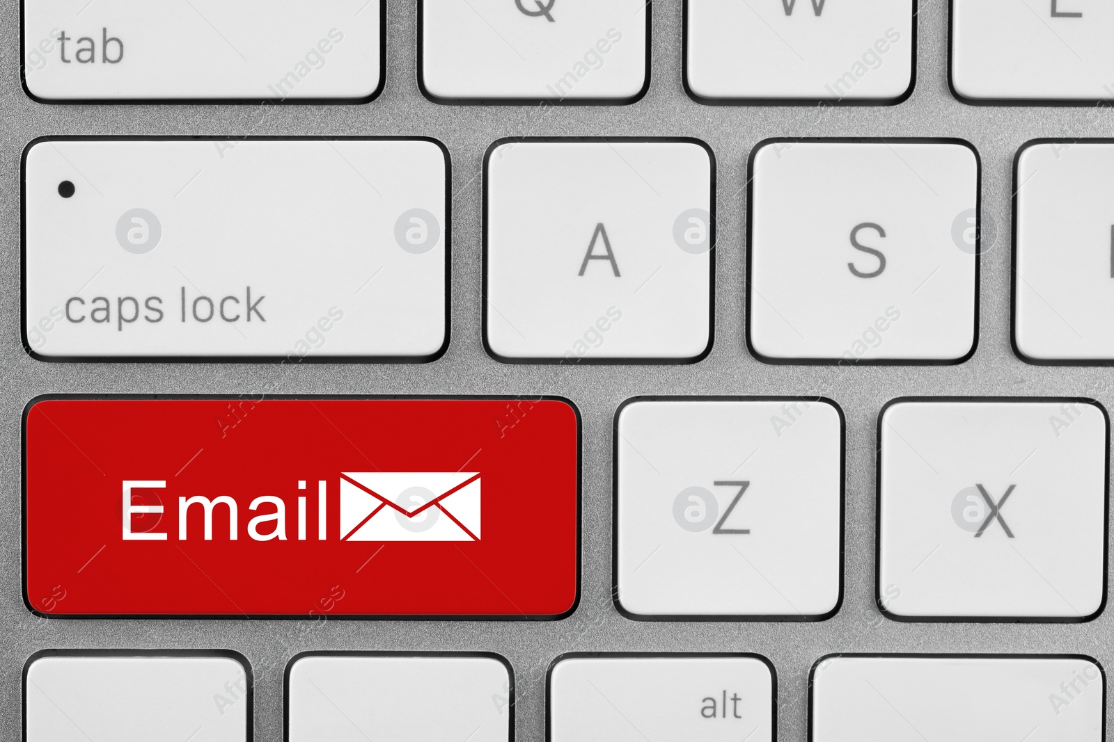 Image of Red button with word Email and illustration of envelope on computer keyboard, top view