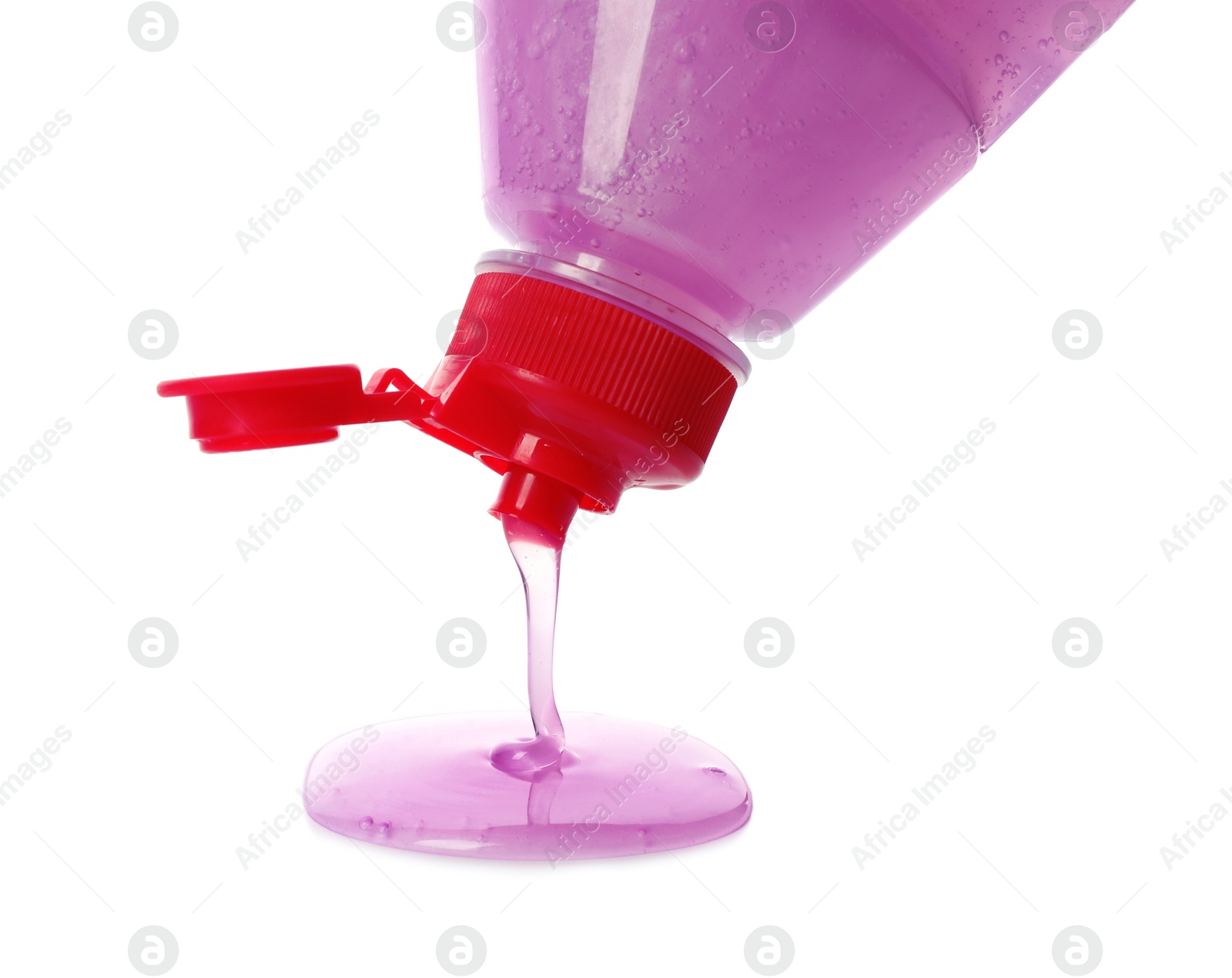 Photo of Pouring cleaning product for dish washing on white background, closeup