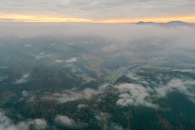 Photo of Aerial view of beautiful mountains on cloudy day
