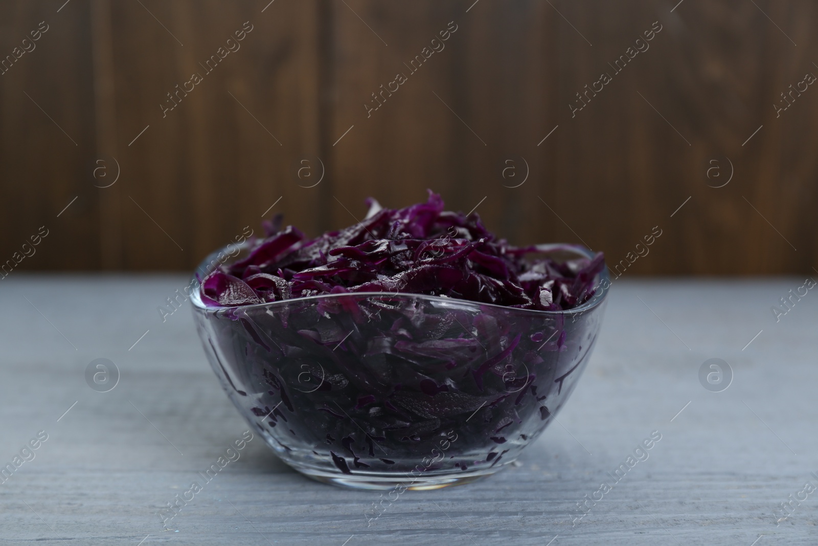 Photo of Tasty red cabbage sauerkraut on light grey wooden table