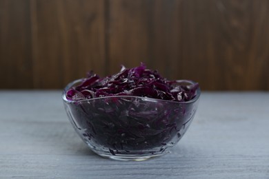 Photo of Tasty red cabbage sauerkraut on light grey wooden table