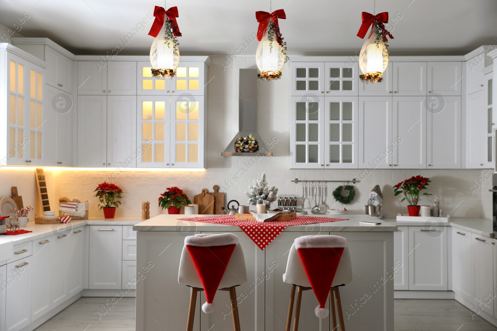 Photo of Stylish kitchen interior with beautiful Christmas decor