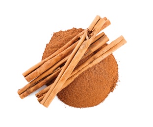 Photo of Aromatic cinnamon sticks and powder on white background, above view