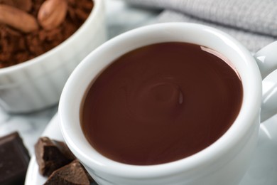 Photo of Yummy hot chocolate in cup on table, closeup