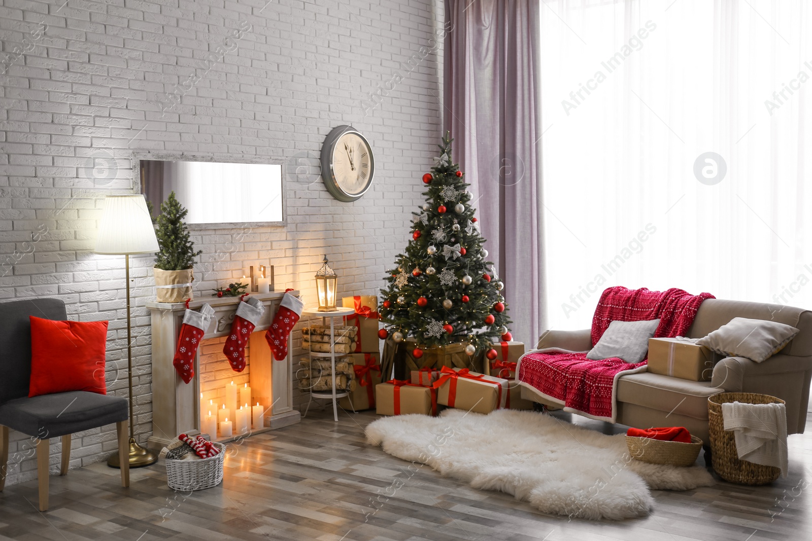 Photo of Stylish interior with beautiful Christmas tree and decorative fireplace