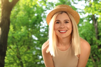 Photo of Portrait of beautiful woman in straw hat outdoors on sunny day