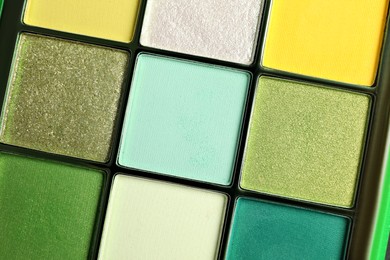 Beautiful palette of colorful eyeshadows as background, closeup