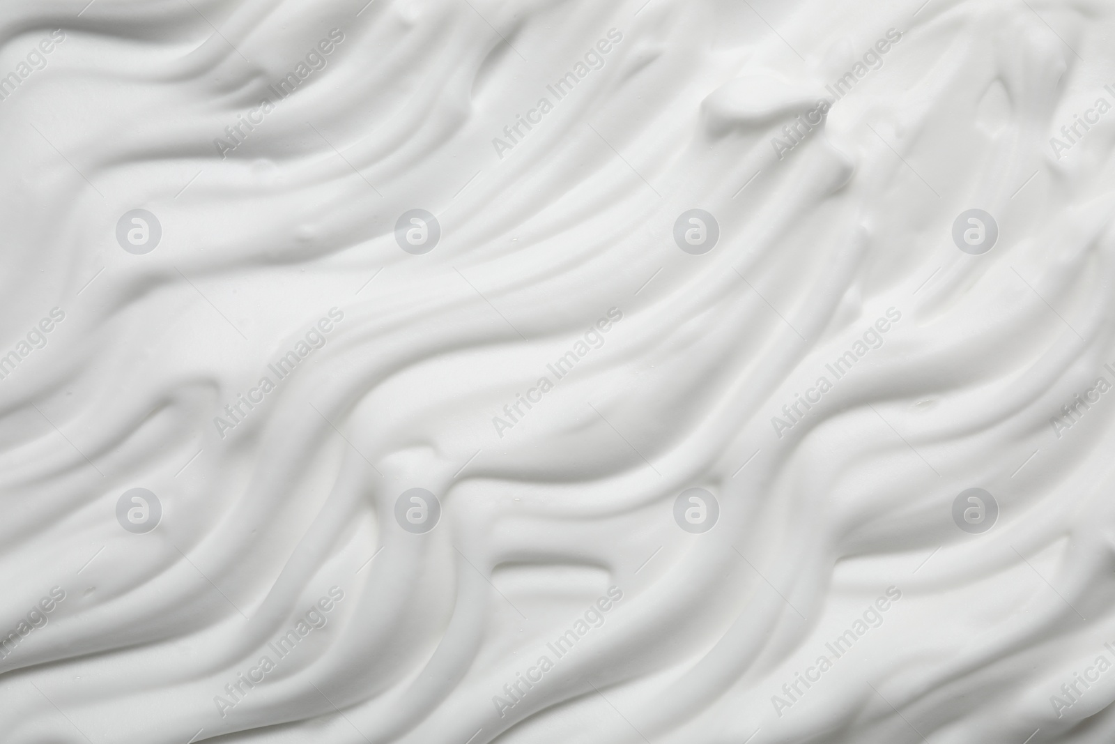 Photo of Texture of white shaving foam as background, top view