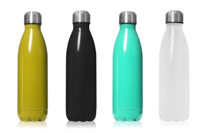 Image of Set of modern thermos bottles in different colors on white background 