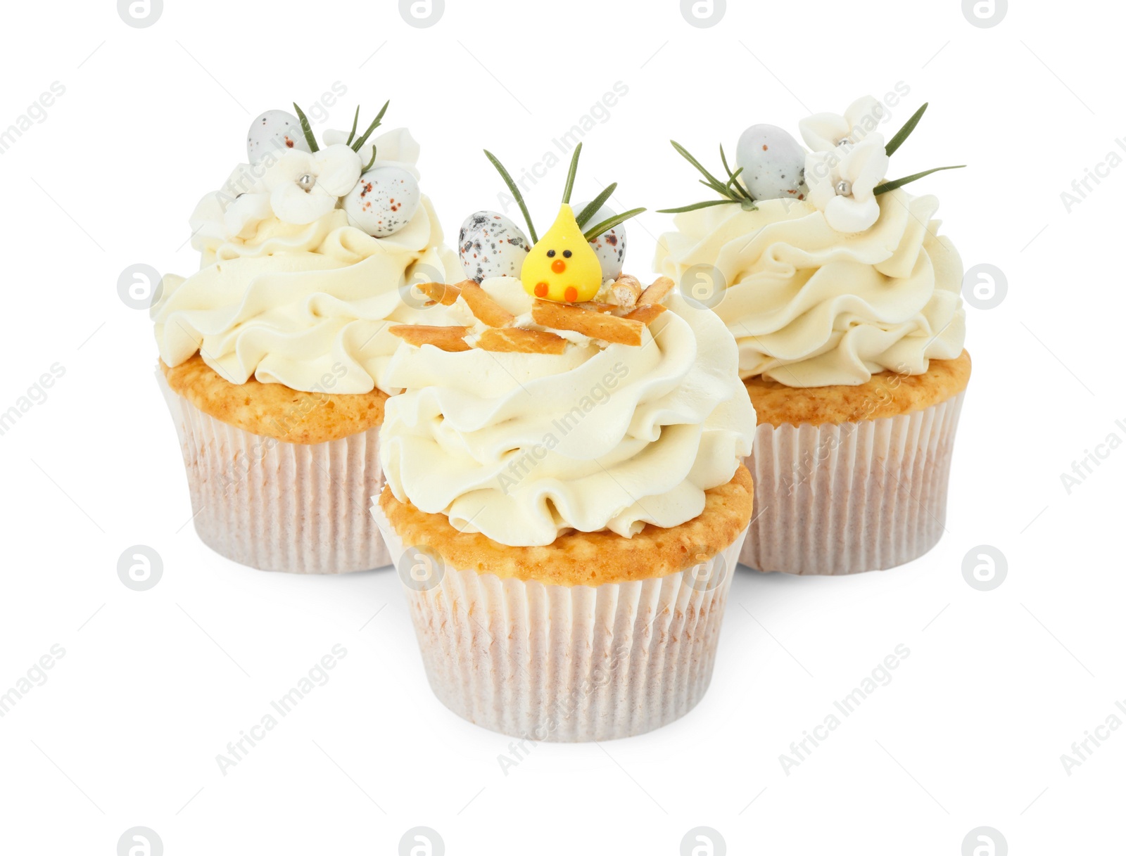 Photo of Tasty Easter cupcakes with vanilla cream isolated on white