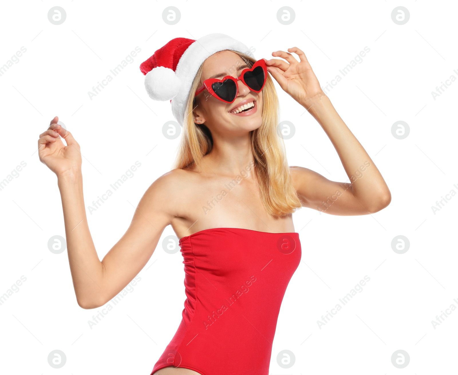 Photo of Young woman wearing Santa Claus hat on white background. Christmas vacation