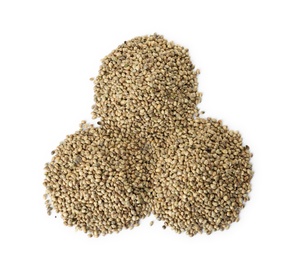 Piles of hemp seeds on white background, top view