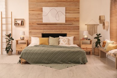 Photo of Stylish room interior with big comfortable bed