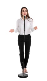 Young stylish woman with microphone on white background