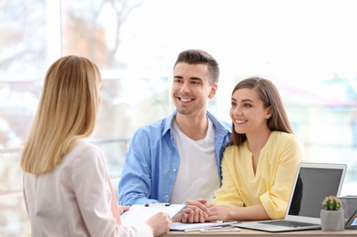 Young couple meeting with consultant in office