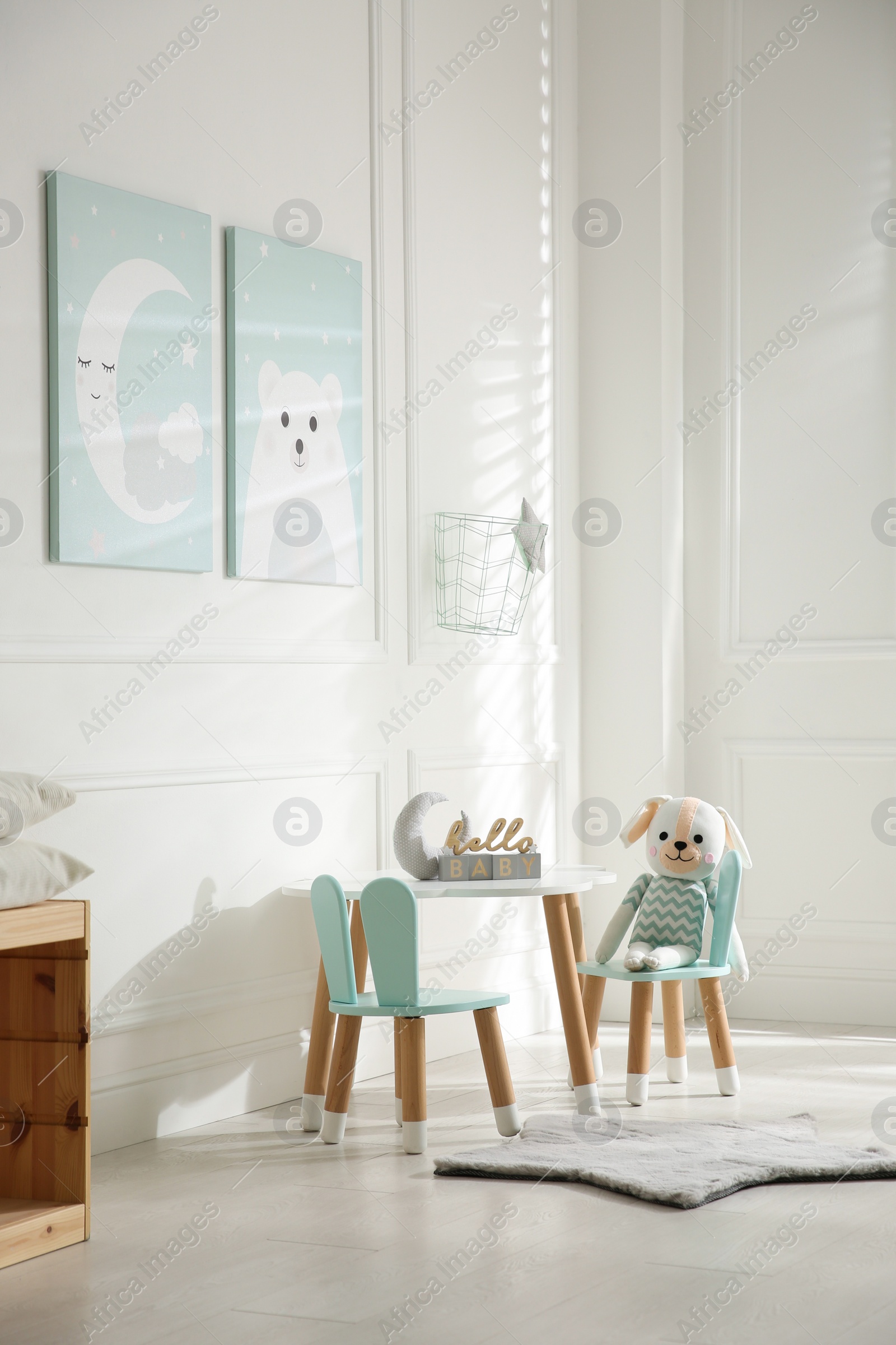 Photo of Baby room interior with stylish furniture and toys